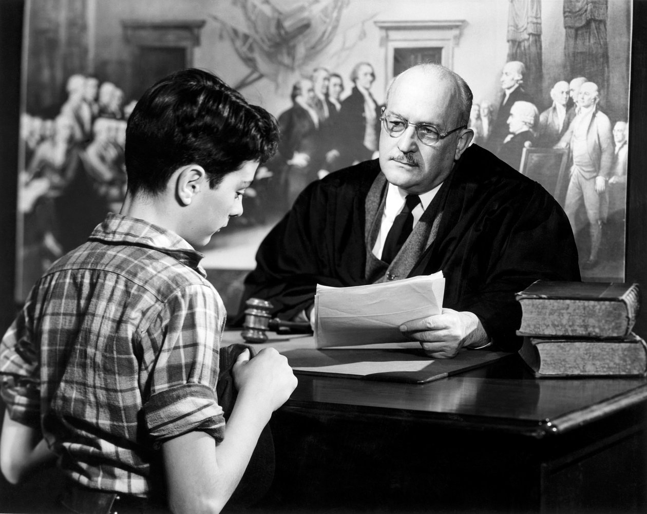Judge Sitting at His Desk Talking to a Boy by Unknown