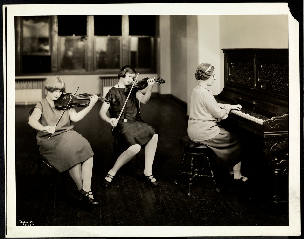 Group of Three Young Blind Women, One at the Piano, Two Playing Violins, at the New York Association for the Blind by Byron Company