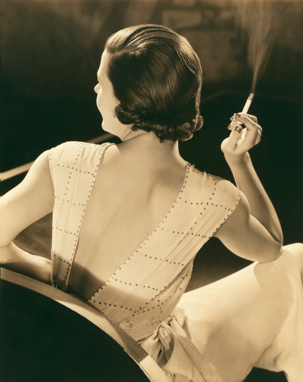 A Glamorous Woman Smoking by Unknown