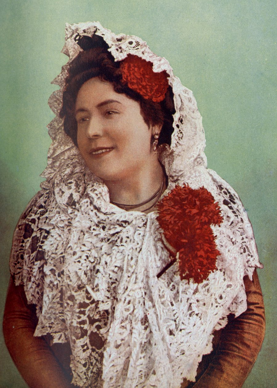 Spain. Scarlet Blossoms and White Lace Mantilla Draped Over Hair and Shoulders Display to Advantage the Southern Beauty of the Andalusian. 1920 by Unknown
