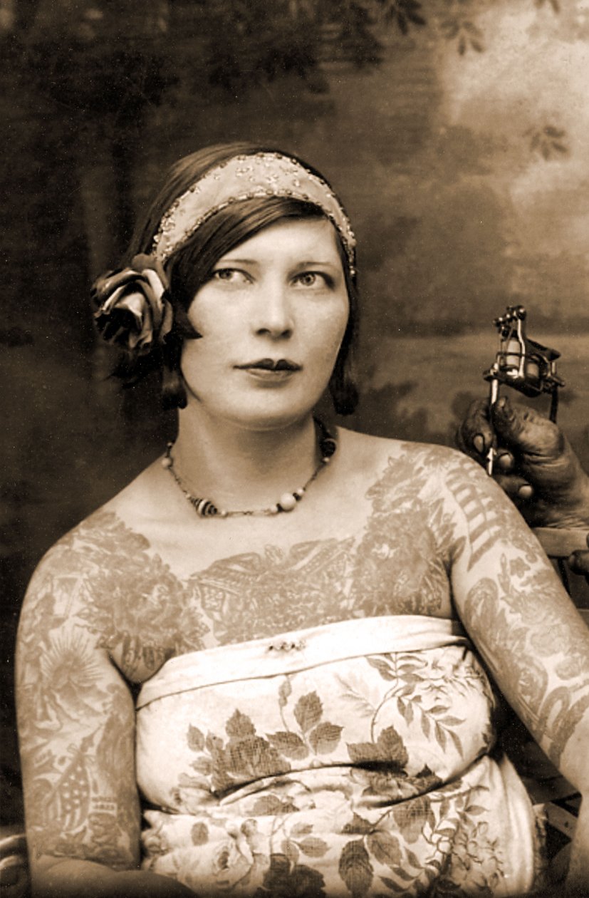 Woman Getting Tattooed by Charles Wagner by Unknown