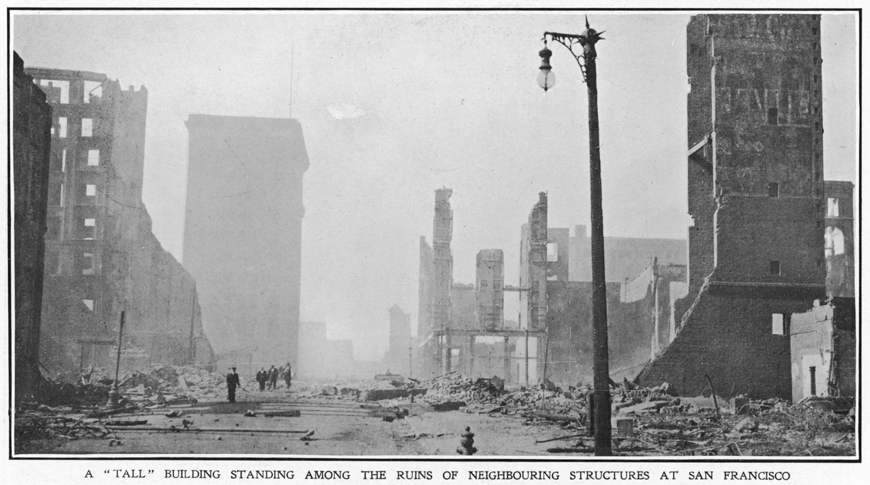 A tall building standing among the ruins of neighbouring structures after the 1906 San Francisco earthquake, 1906 by American Photographer