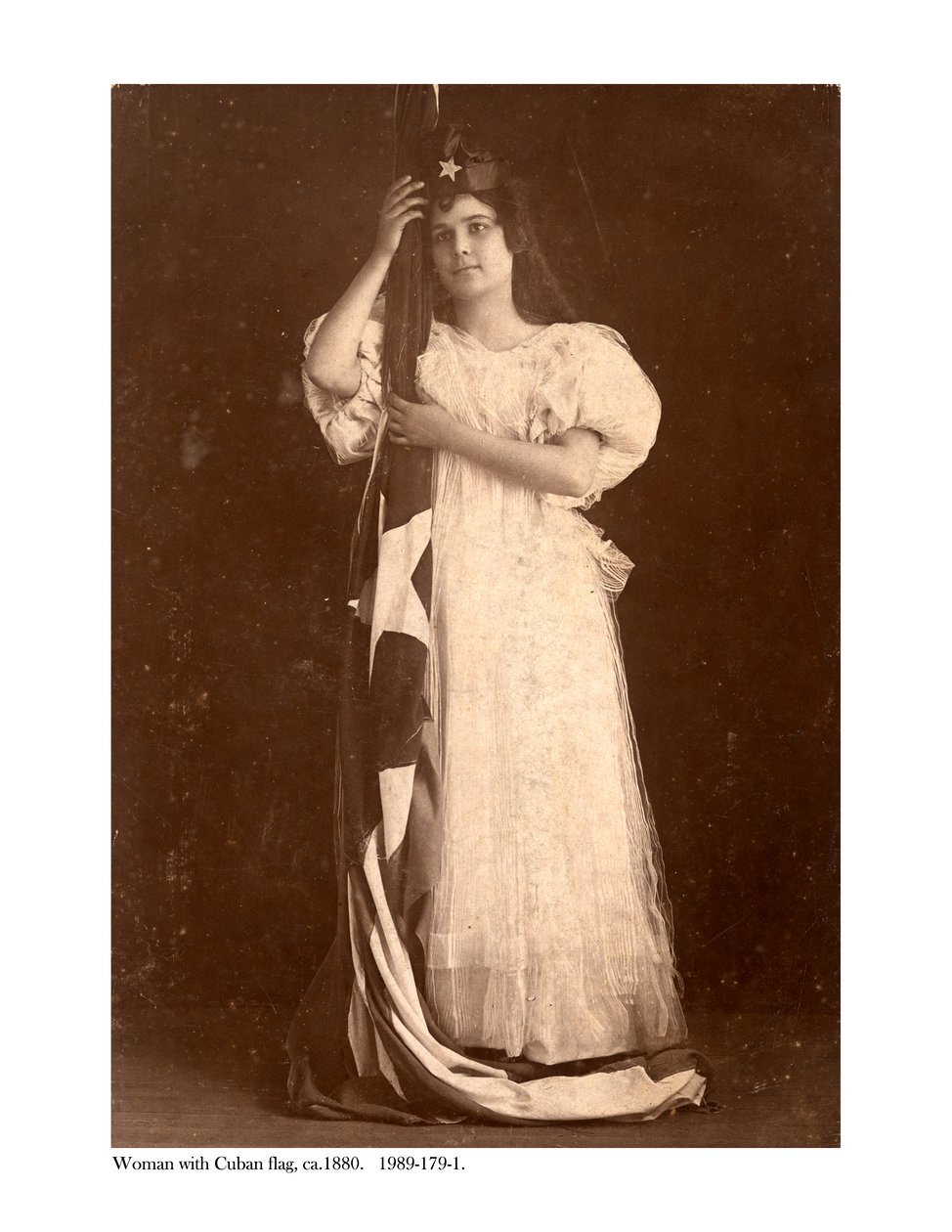 Woman with Cuban flag, c.1880 by American Photographer
