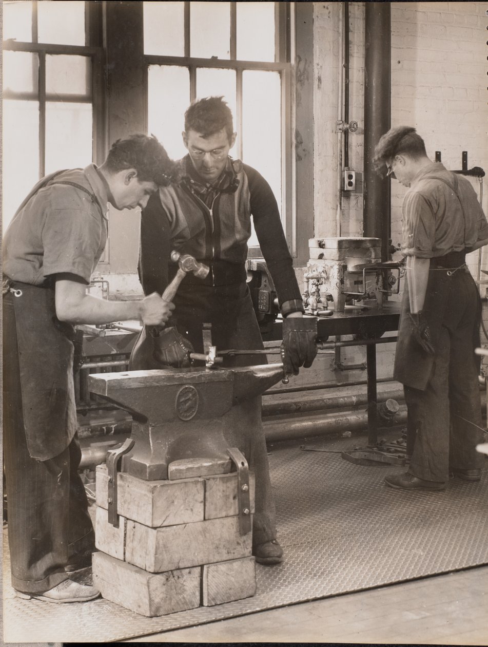Two Men Hammer Metal on an Anvil by Arnold Eagle
