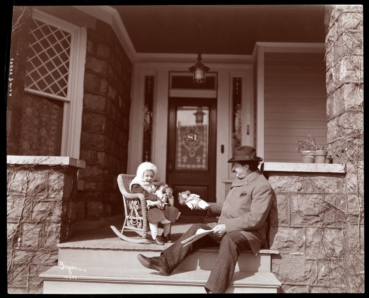 Edgar Smith with his daughter on the steps of his residence in Elmhurst, Long Island, 1902-3 by Byron Company