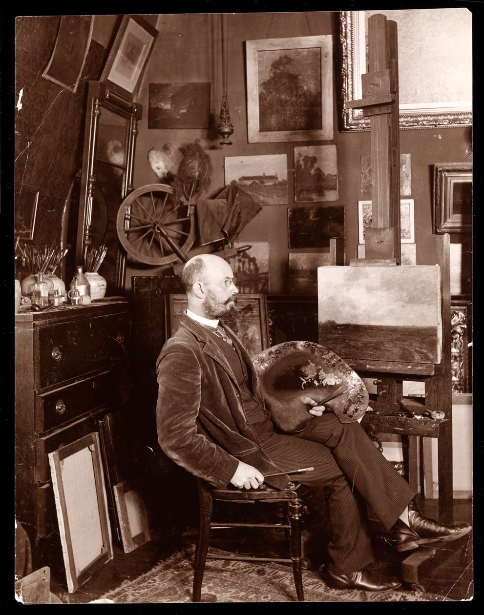 John Francis Murphy in his studio at The Chelsea, West 23rd Street, New York, c.1895 by Byron Company