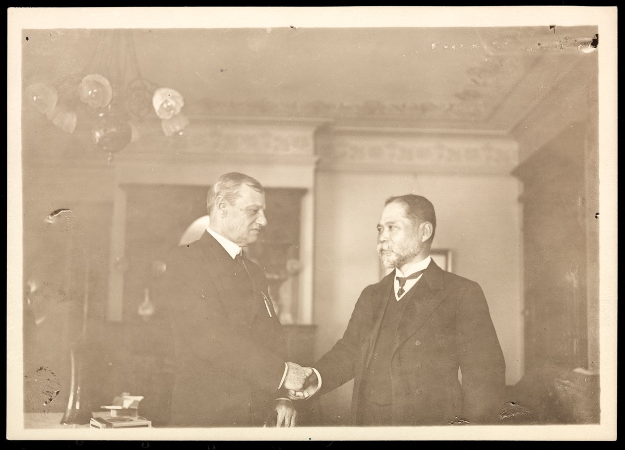 Rear Admiral Robley Dunglison Evans shaking hands with another man, 1906 by Byron Company