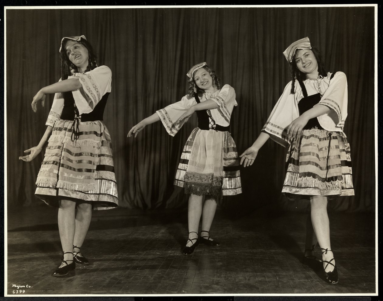 Three Blind Young Women in Costume Dancing on Stage in a Play at the New York Association for the Blind, New York, 1931 by Byron Company