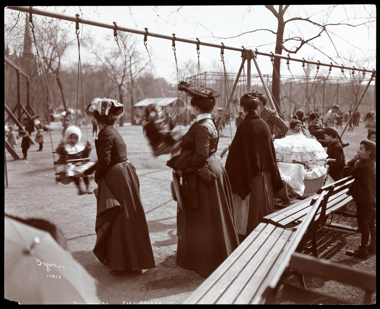 View of a Woman Pushing Children on the Swings at Tompkins Square Park, on Arbor Day, New York, 1904 by Byron Company