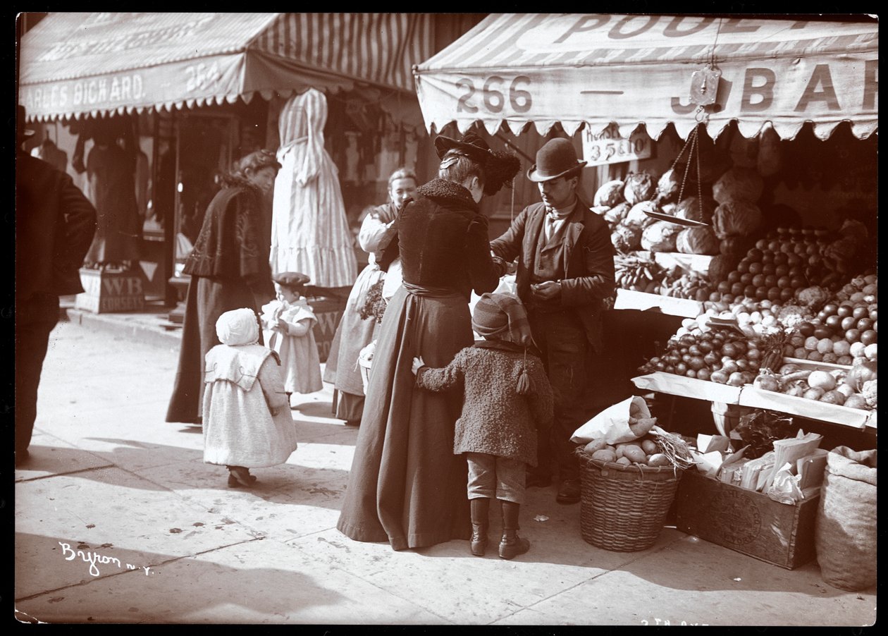 View of Women with Children Shopping at a Fruit and Vegetable Stand at 266 7th Avenue, New York, c.1900 by Byron Company