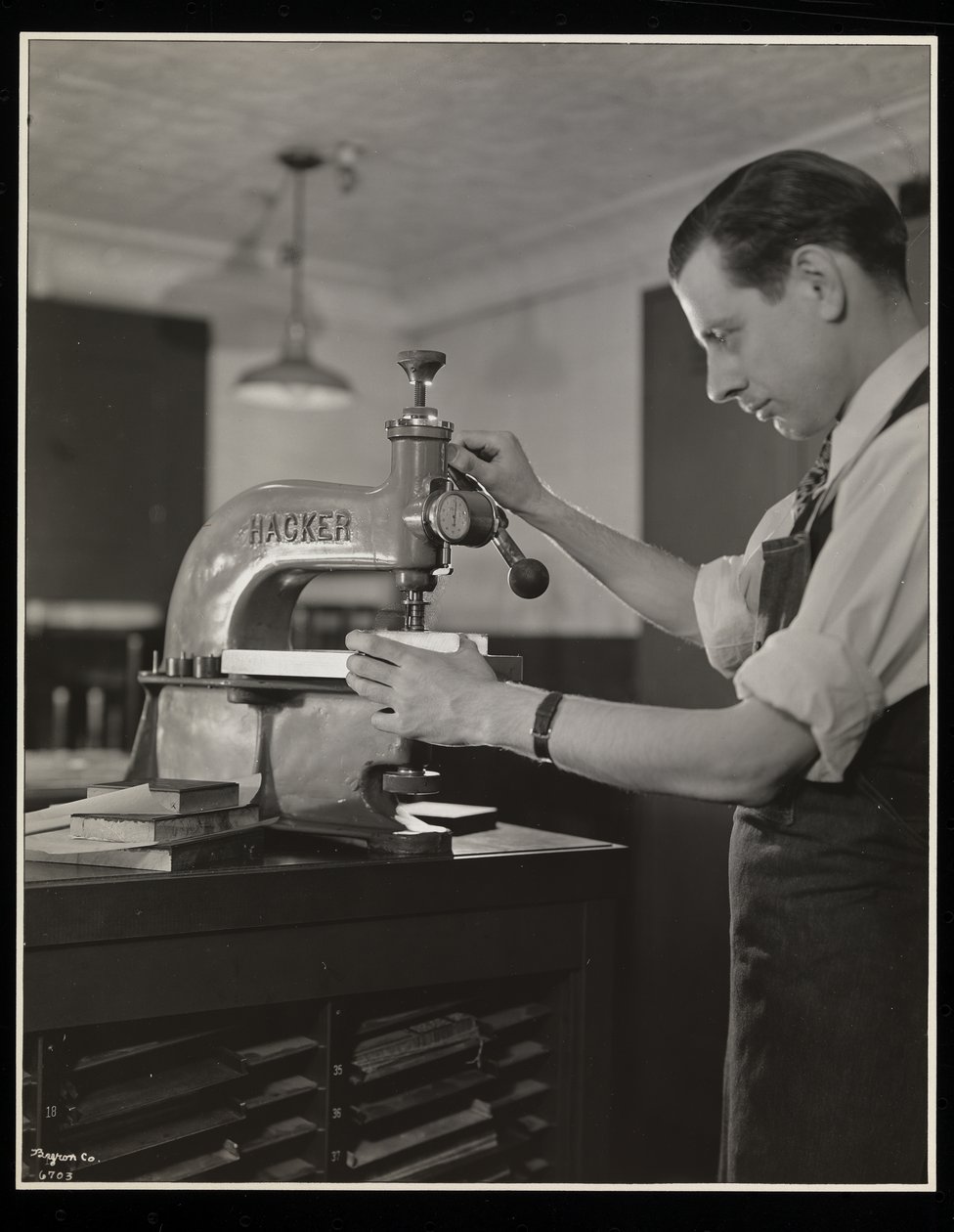 Working on type at Unz und Co., 24 Beaver Street, New York, 1932 by Byron Company