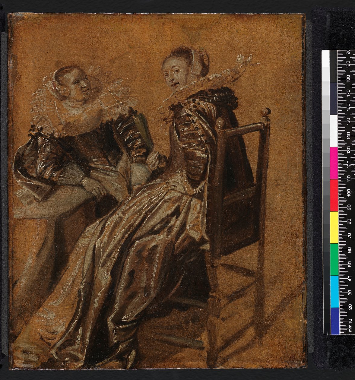 Two ladies seated at a table by Dirck Hals