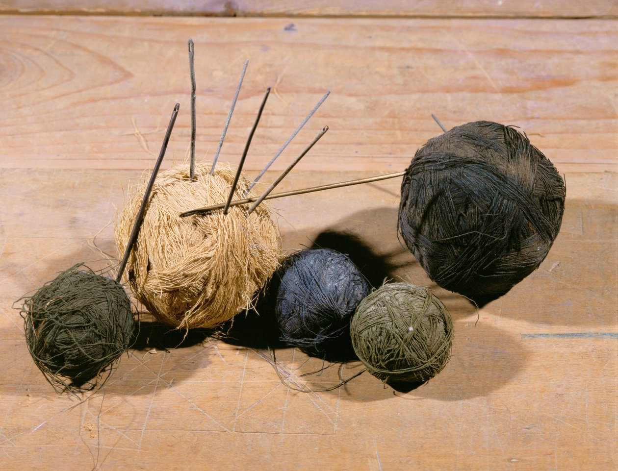 Wool balls with knitting needles by Egyptian 18th Dynasty