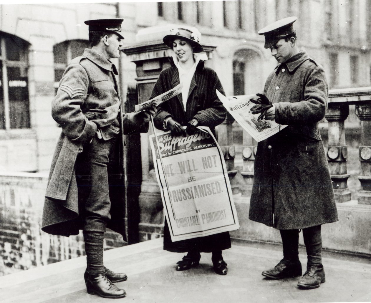 A Suffragette Selling Newspapers to Two Soldiers by English Photographer
