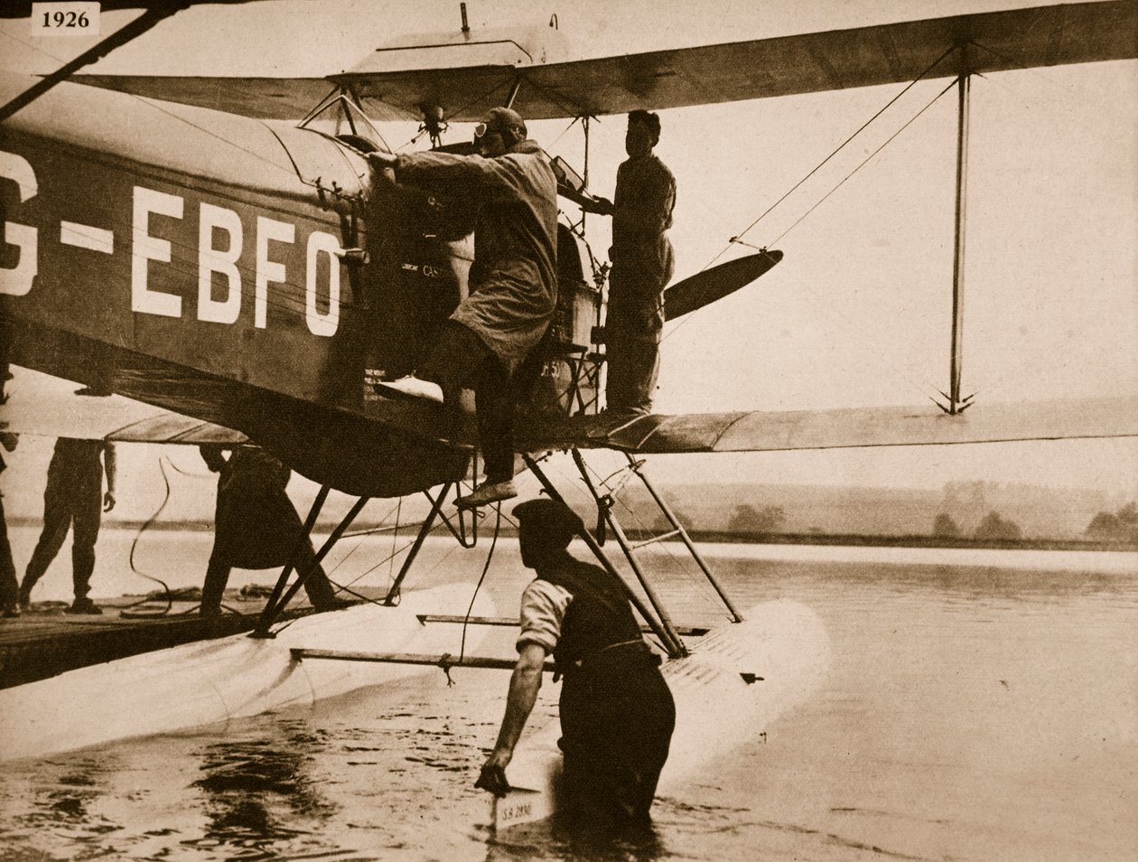 Alan Cobham climbing into his plane before setting off for Australia, Rochester, 1926 by English Photographer