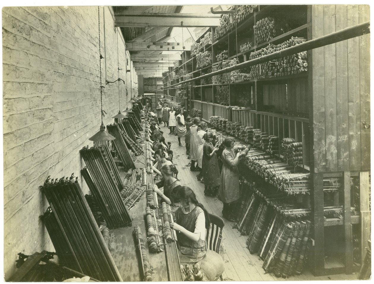 Axminster threading, carpet factory, 1923 by English Photographer