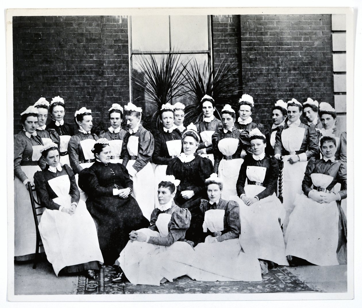 Miss Gordon, Miss Crossland and twenty nurses and sisters by English Photographer