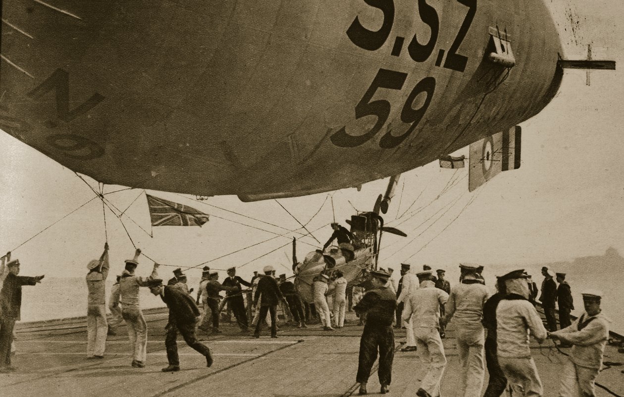 Naval airship coming down to her mooring on the after deck of H.M.S. Furious, 1914-19 by English Photographer