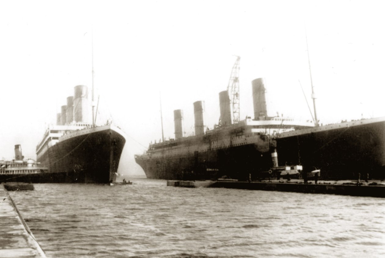 RMS Titanic being moved out of drydock to allow her sister ship, RMS Olympic, to have a propeller replaced, March 6, 1912 by English Photographer