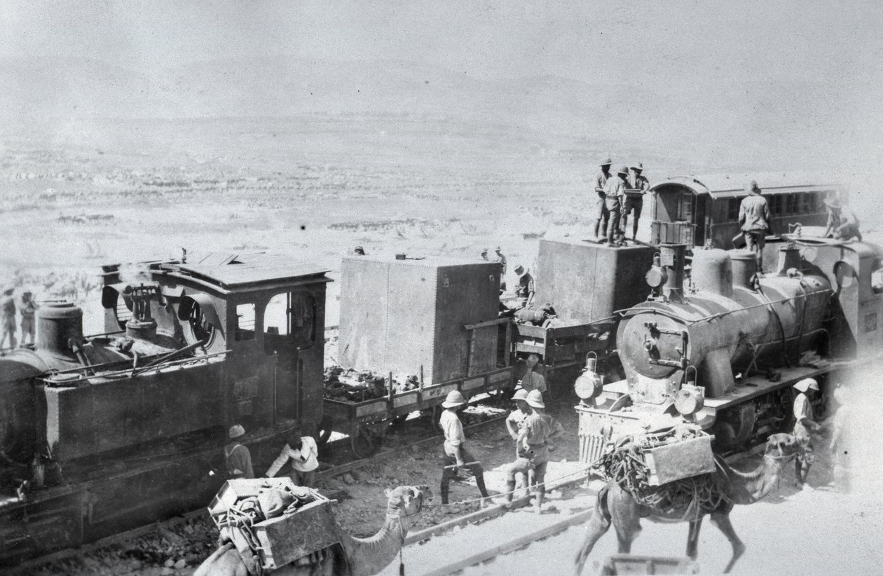 Railway locomotives with supply camels in Mesopotamia during World War One, from an album compiled by Lt. Kindom by English Photographer