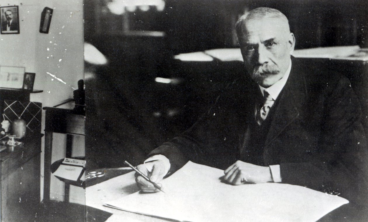Sir Edward Elgar at work on one of his orchestral scores by English Photographer