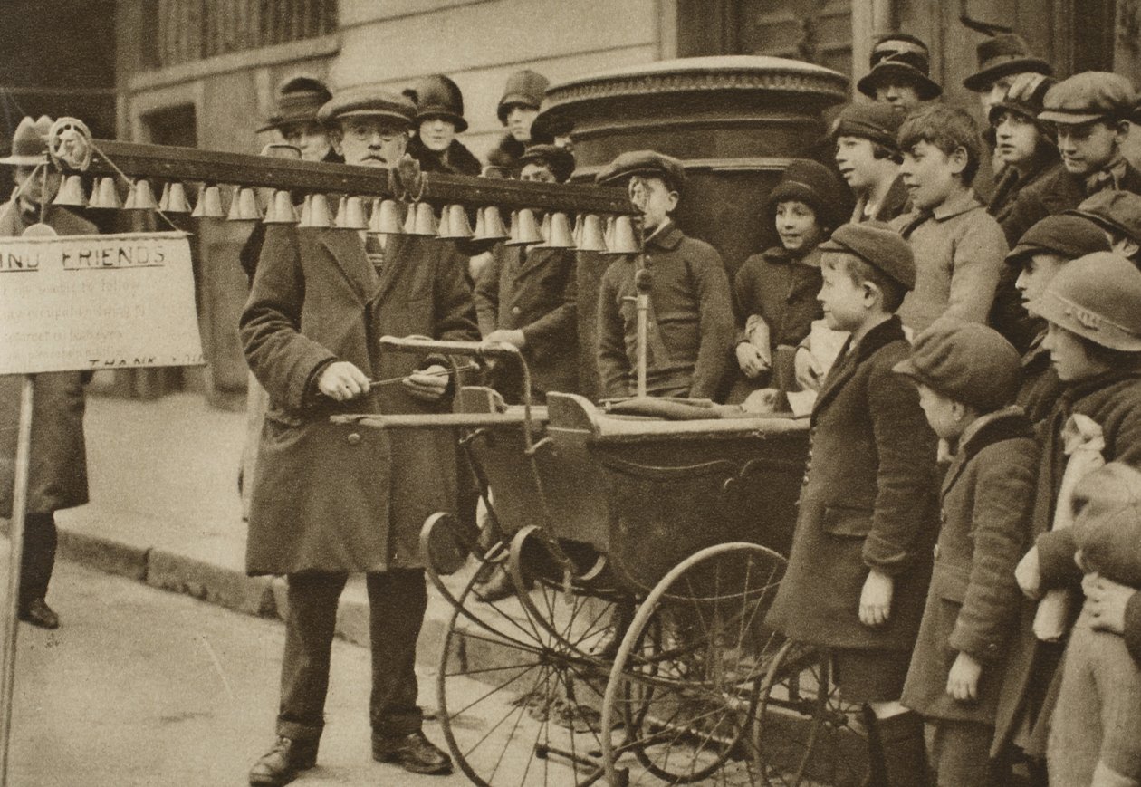 Street entertainment for children: portable bells, London by English Photographer