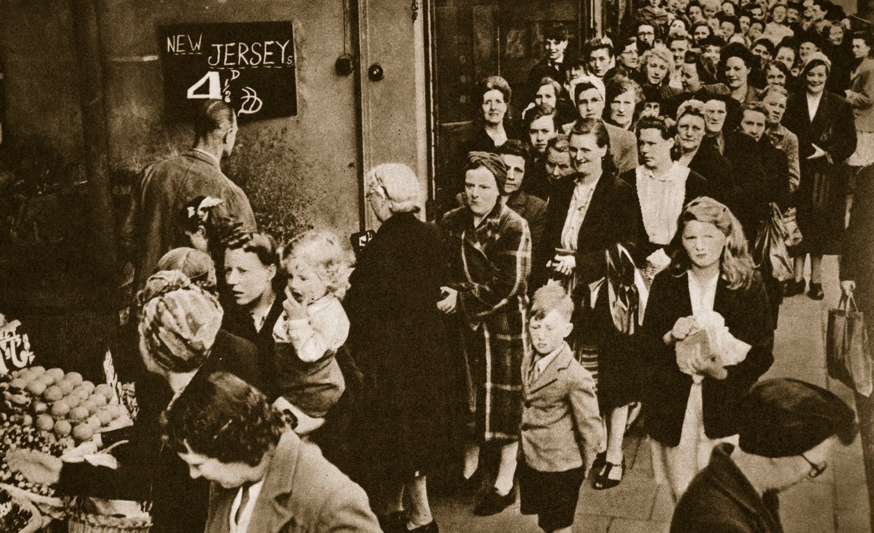 Women queue at a fruit and vegetable stall in London, June 1947 by English Photographer