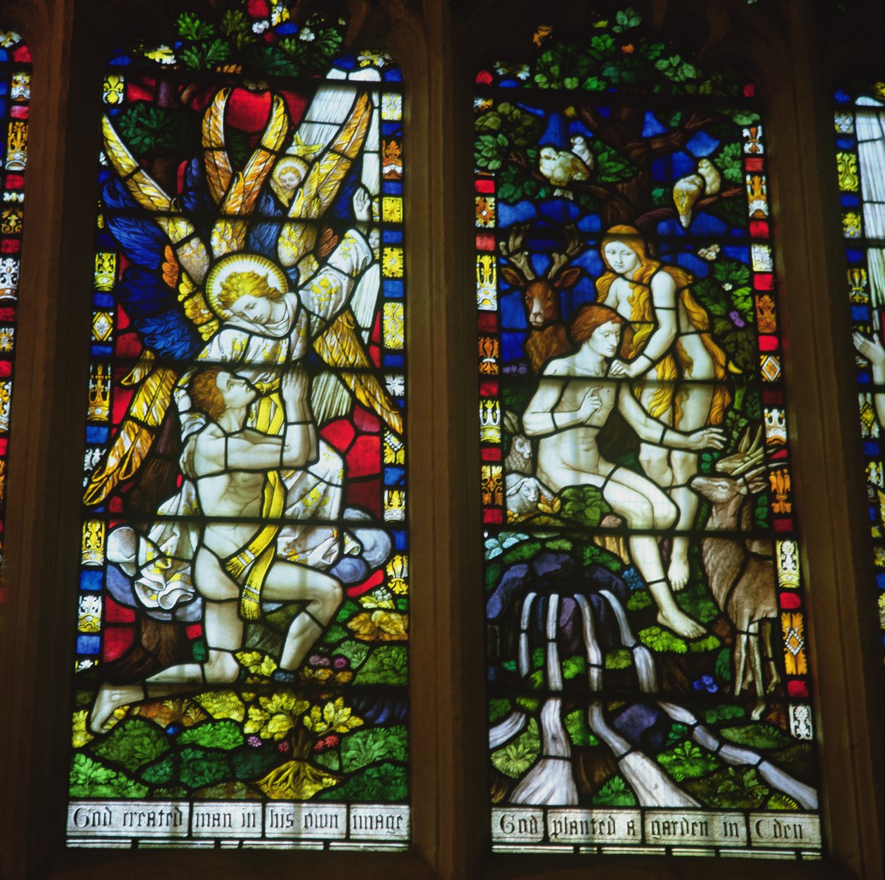 Stained glass windows depicting The Annunciation and Adam and Eve in the Garden of Eden by English School