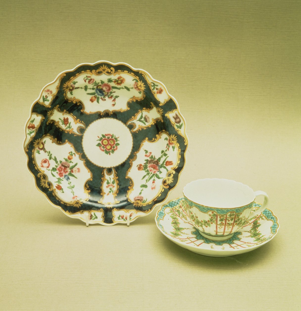 Worcester porcelain plate with scale blue decoration, 1768; teacup and saucer with hop trellis-work decoration, c.1770 by English School