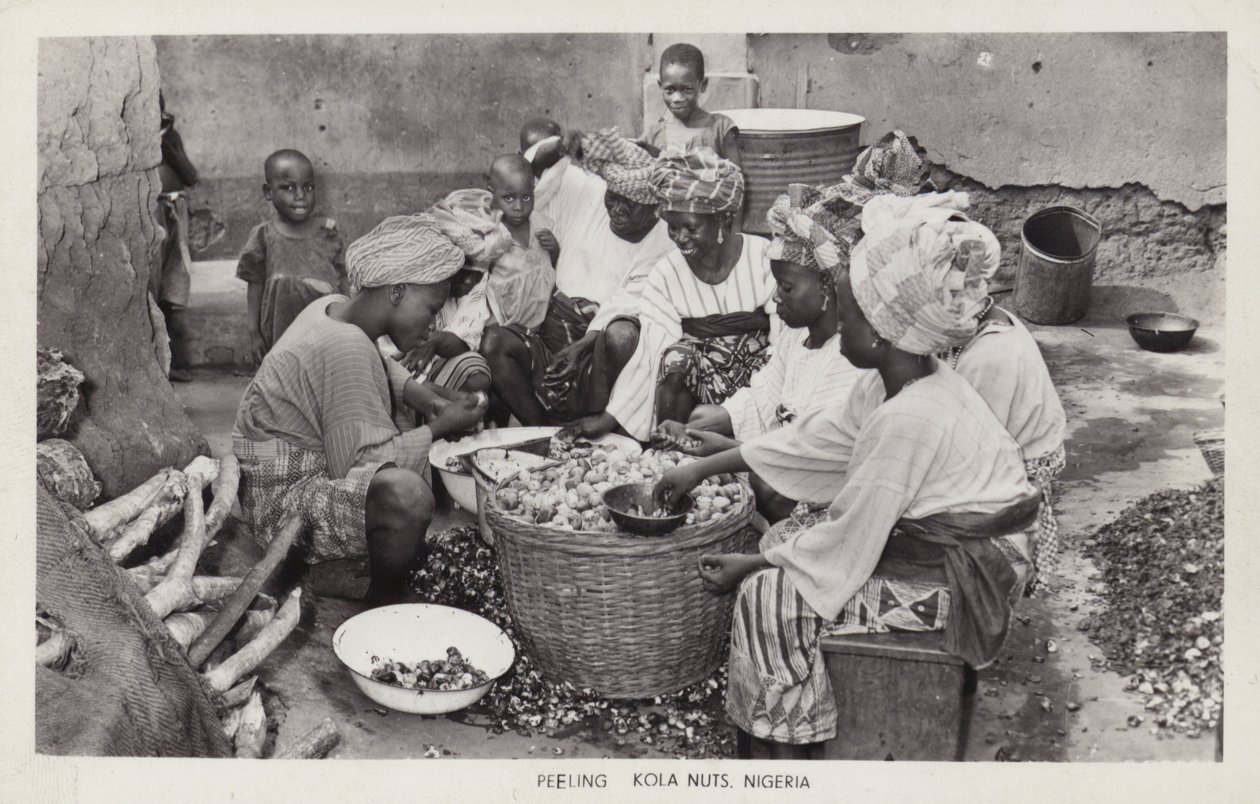 Women peeling kola nuts, Nigeria by English Photographer