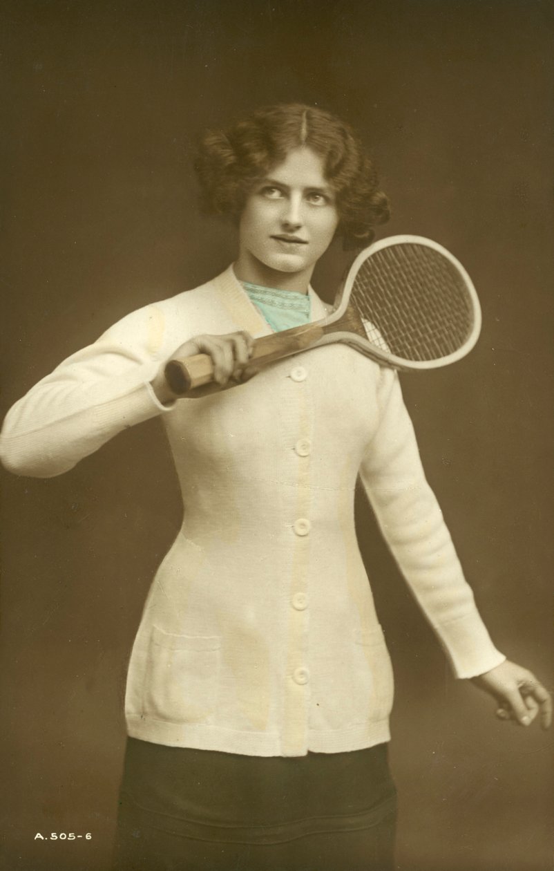 Girl holding tennis racquet by English School