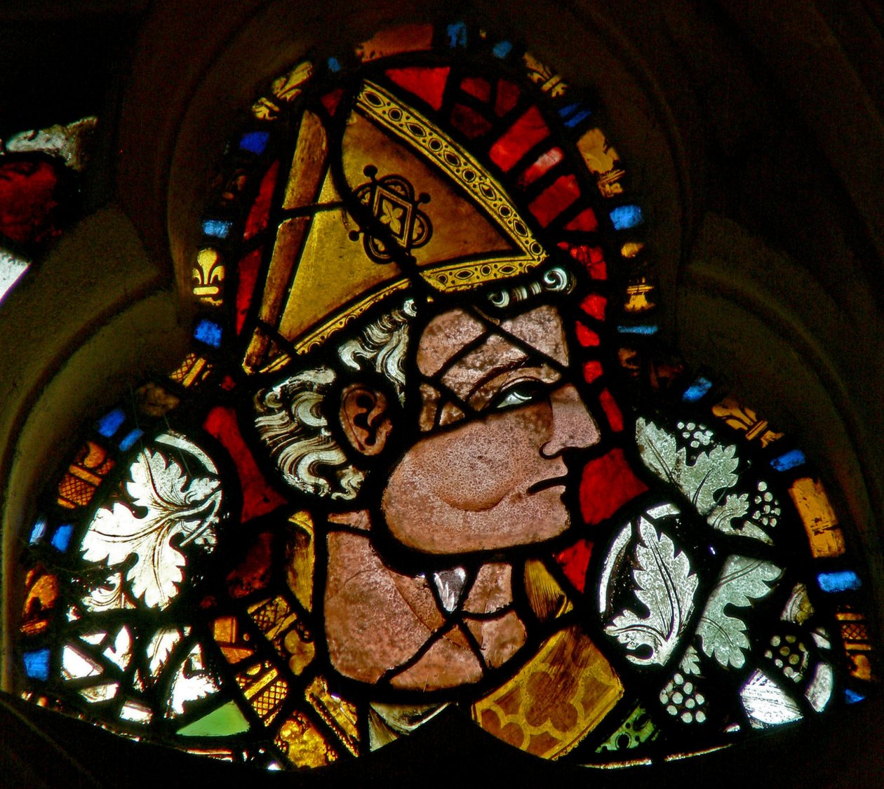 Window 2 depicting a bishop by English School