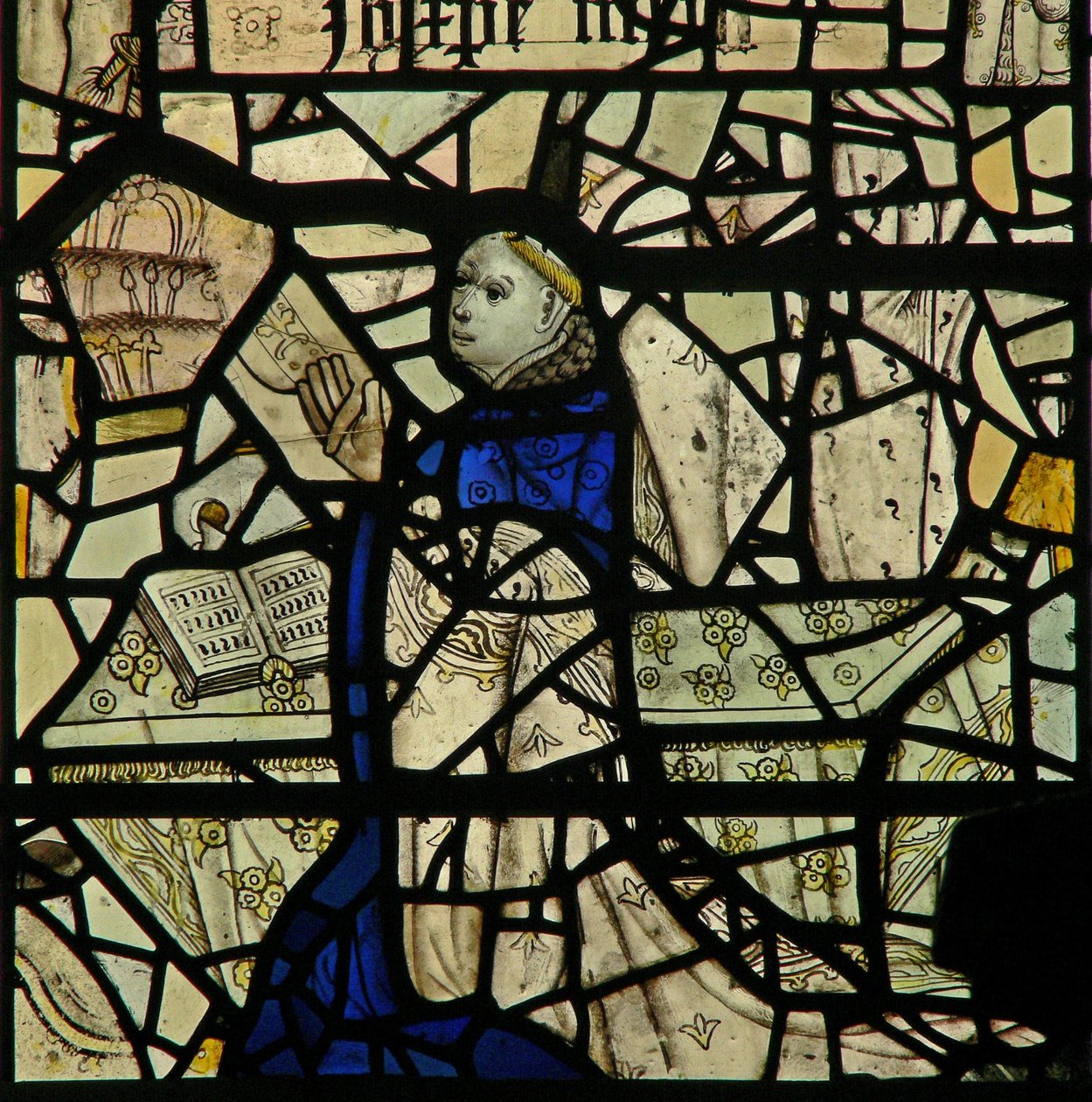 Window W46 depicting a donor priest by English School