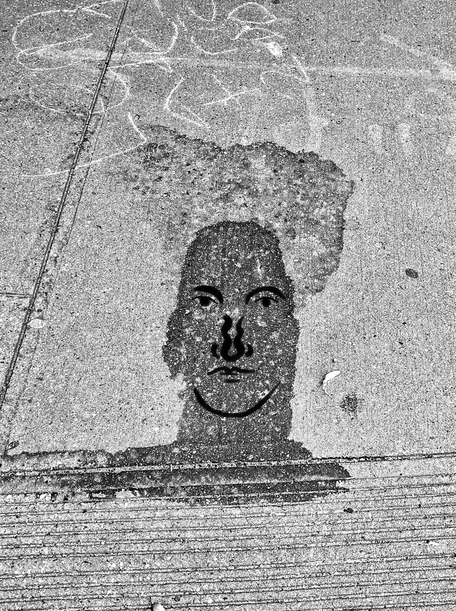 Face On Sidewalk by Evan Sklar