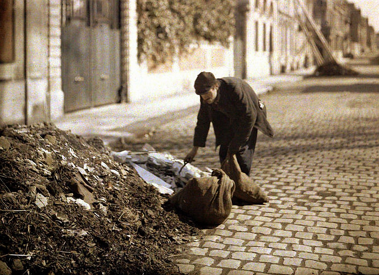 Rag-picker Searching for Usable Items from a Pile, Reims, Marne, France, 1917 by Fernand Cuville