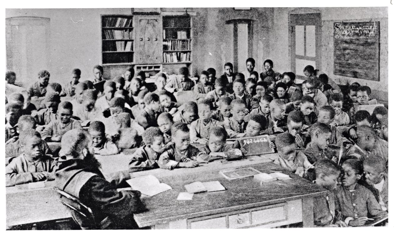 A monk teaching a class in French speaking Africa, before 1914 by French Photographer
