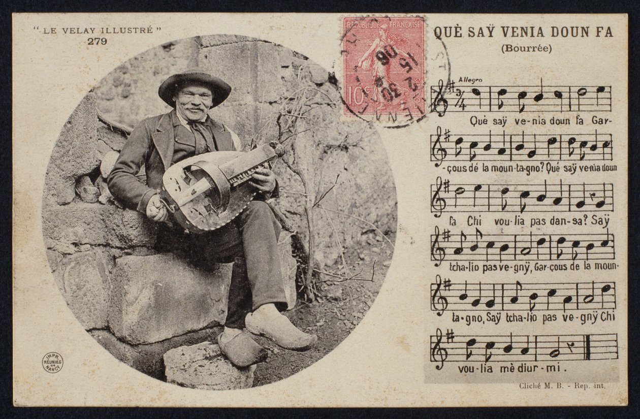 Hurdy Gurdy Player and the Score Sheet of a Bourree, c.1900 by French Photographer