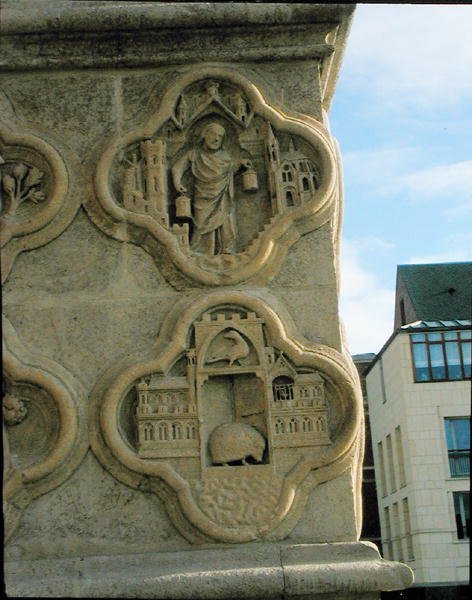 Two quatrefoils on the centre left buttress of the west front by French School