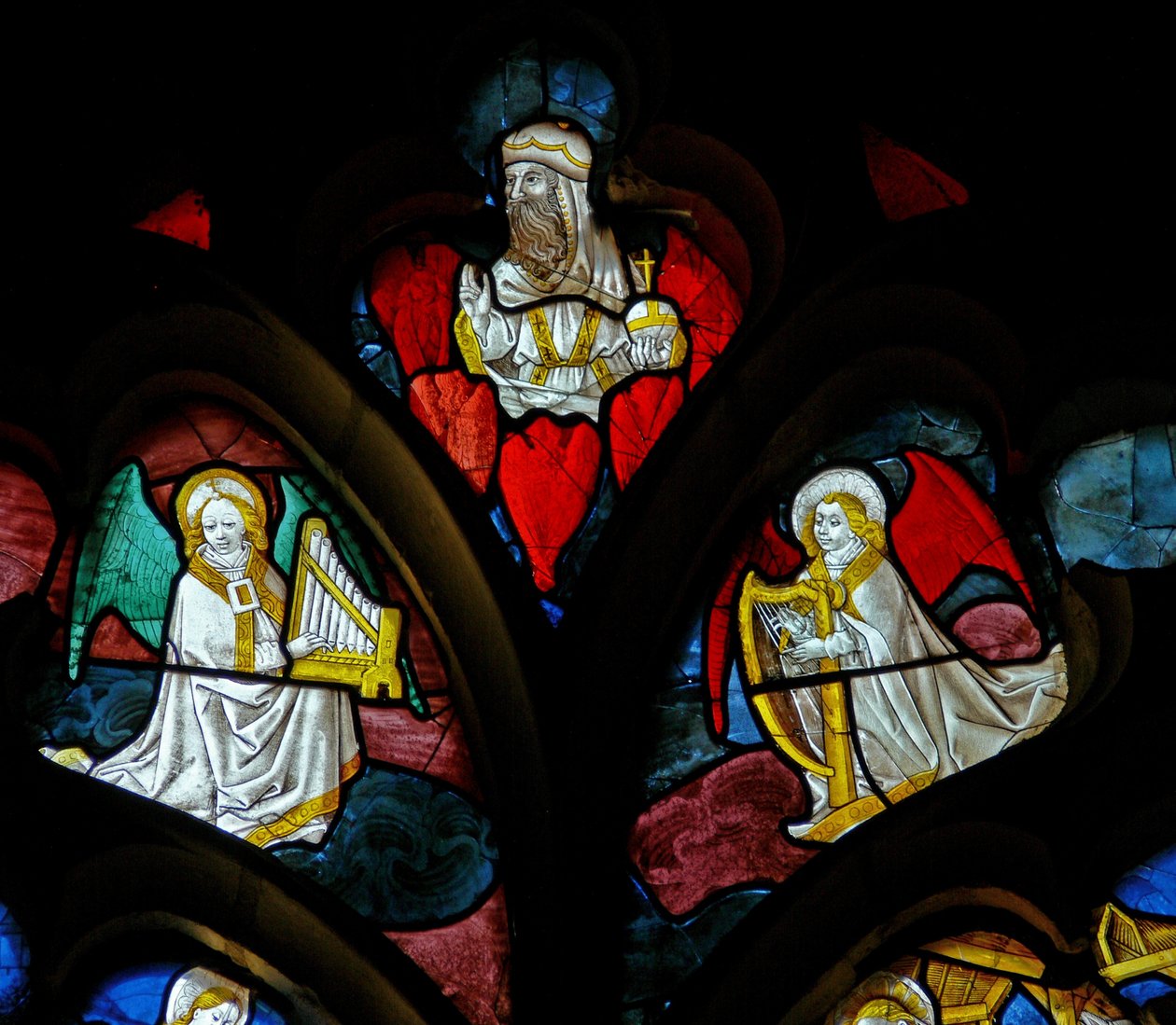 Window depicting musical angels and God by French School