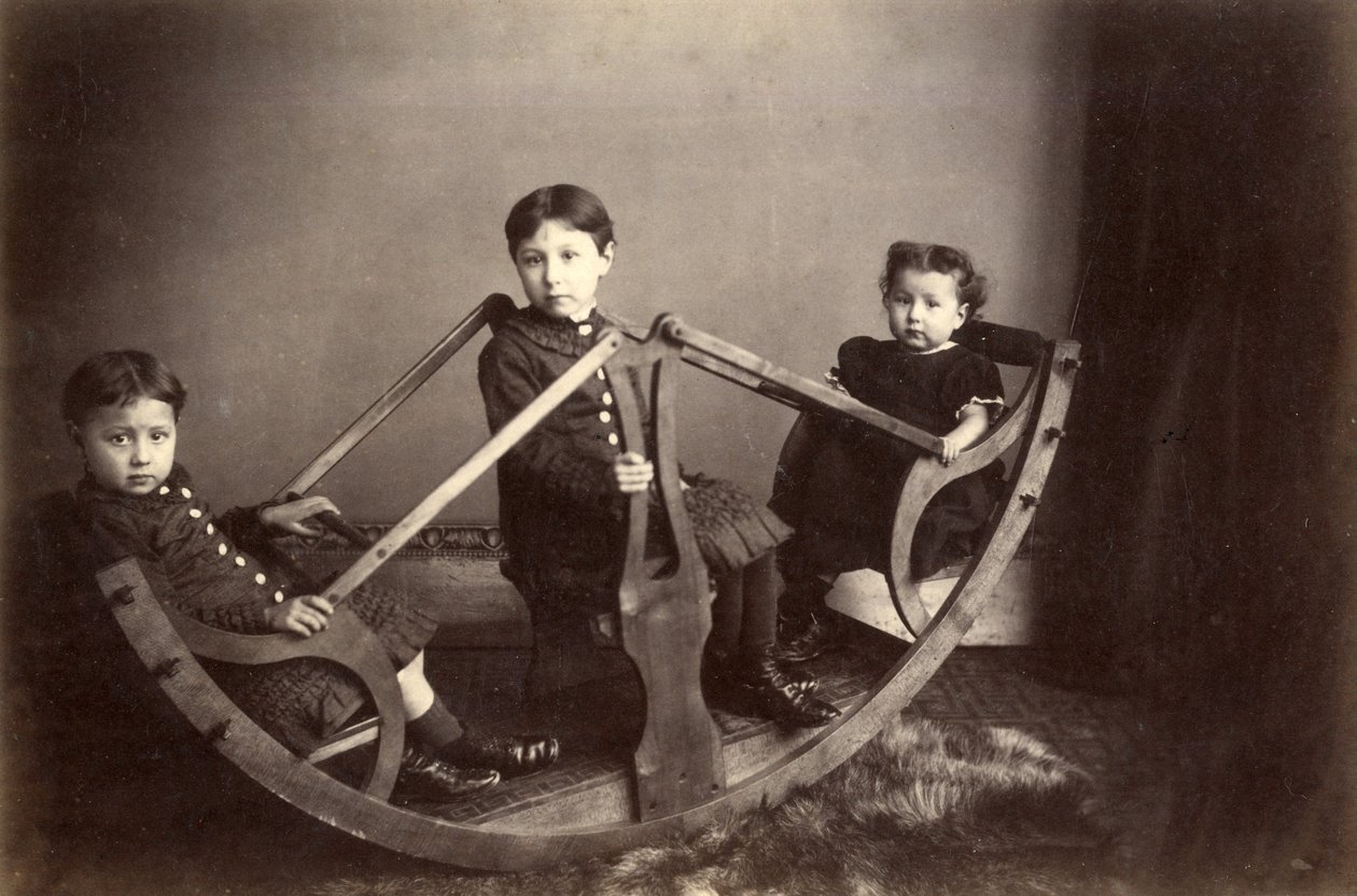 Three Siblings Playing on Their Rocking See-Saw, 1880s by J. S. Brown