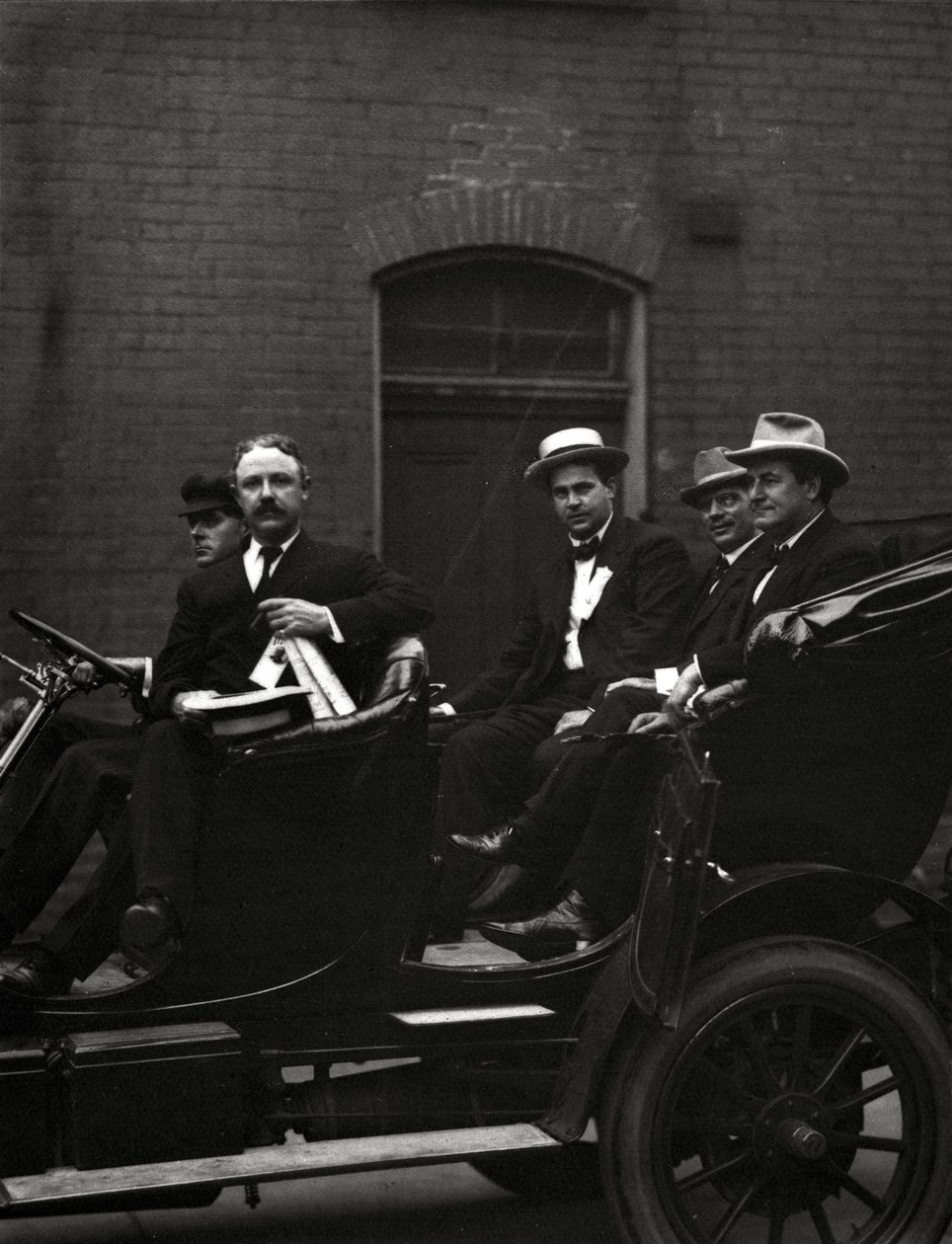 Edward F. Goltra, an unidentified delegate, Rolla Wells, and William Jennings Bryan arriving at a session of the 1916 Democratic National Convention, St. Louis, 11-14 June 1916 by J.C. Strauss
