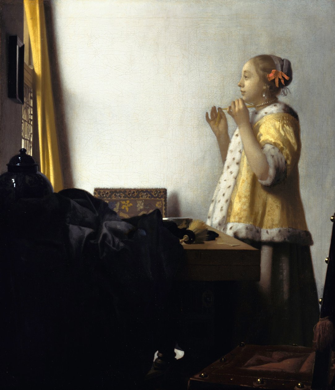 Young Woman with a Pearl Necklace by Jan Vermeer van Delft