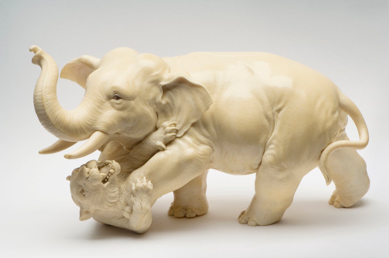 Okimono of an elephant trampling a tiger by Japanese School