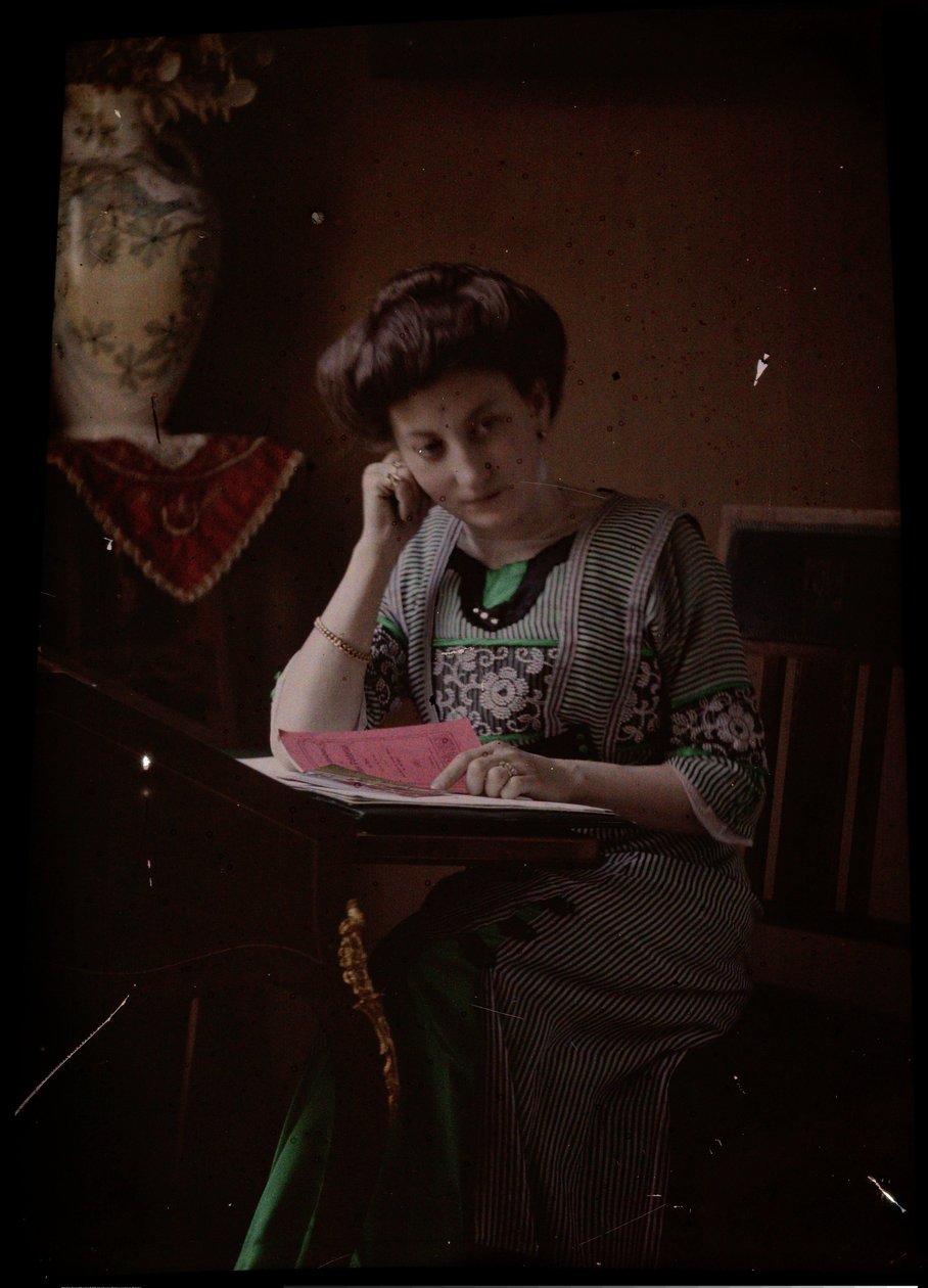 Woman Behind Reading Table by Johannes Hendrikus Antonius Maria Lutz