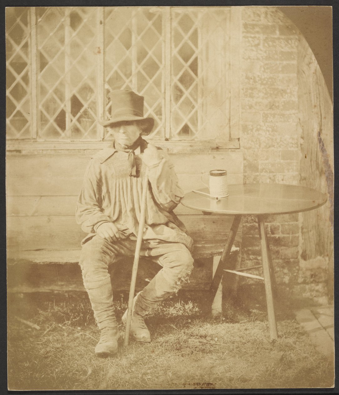 Man seated at table by John Whistler