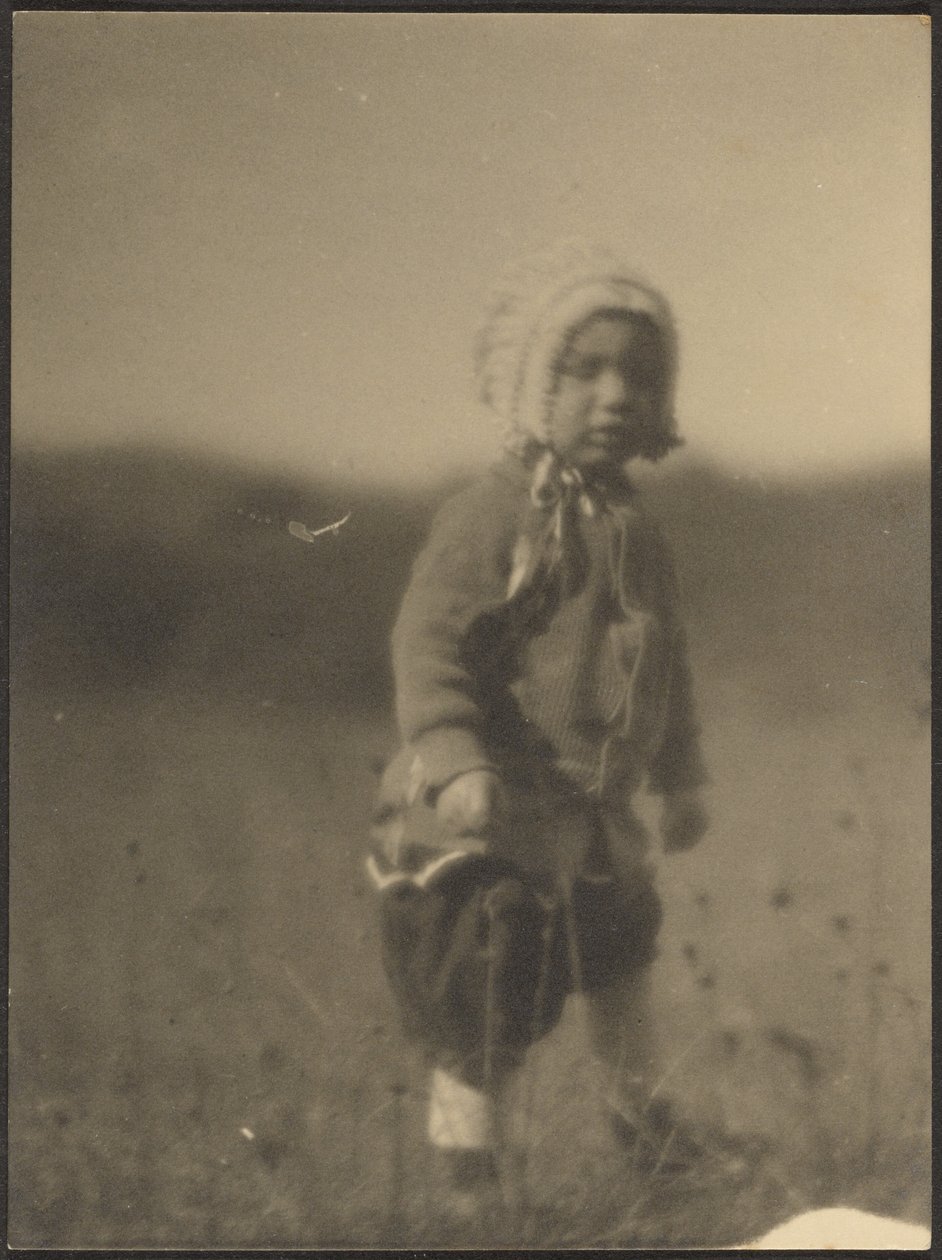 Child Wearing a Bonnet in Field by Louis Fleckenstein