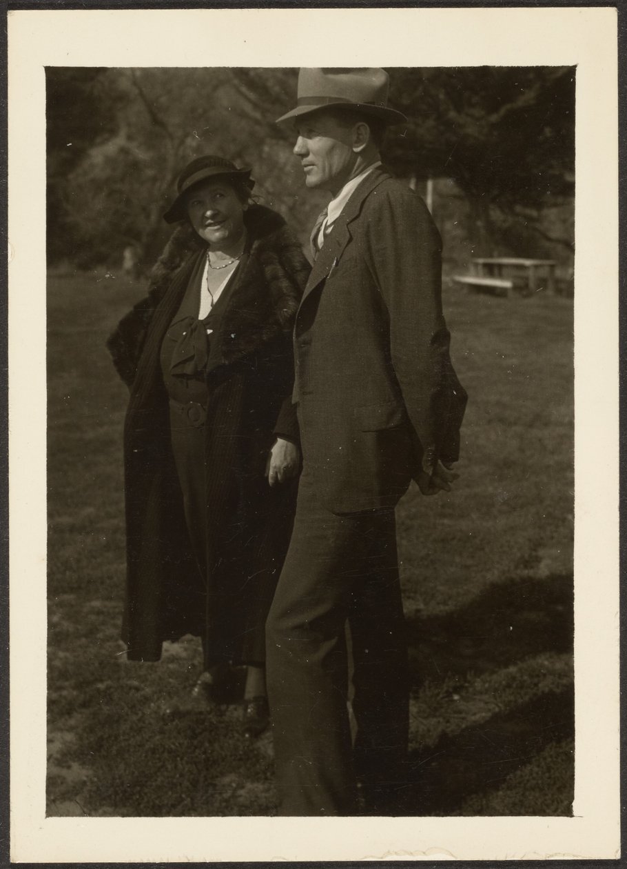 Man and Woman Standing in Grass by Louis Fleckenstein