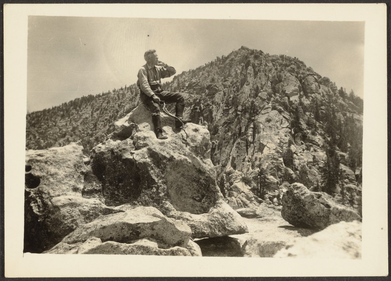 Man Seated on Rocks by Louis Fleckenstein