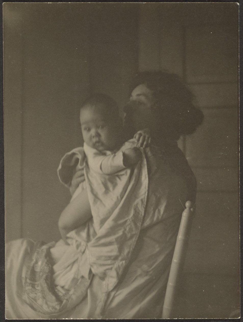 Mother Holding Baby in Chair by Louis Fleckenstein