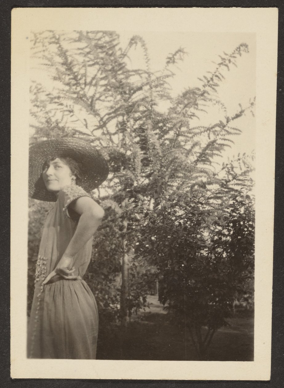 Woman in Hat Standing in Orchard by Louis Fleckenstein